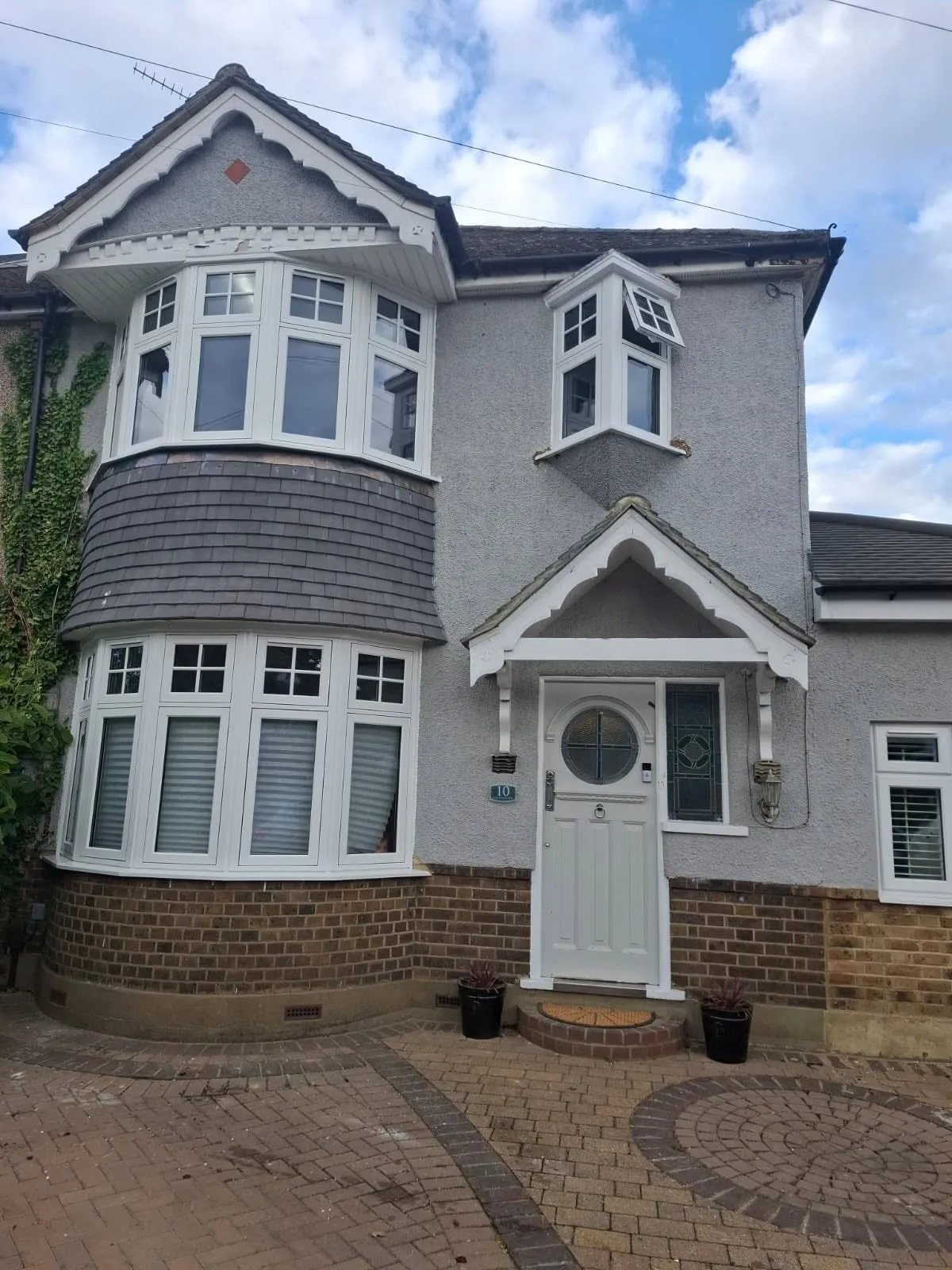 White uPVC fascias, soffits and guttering fitted above replacement bay windows
