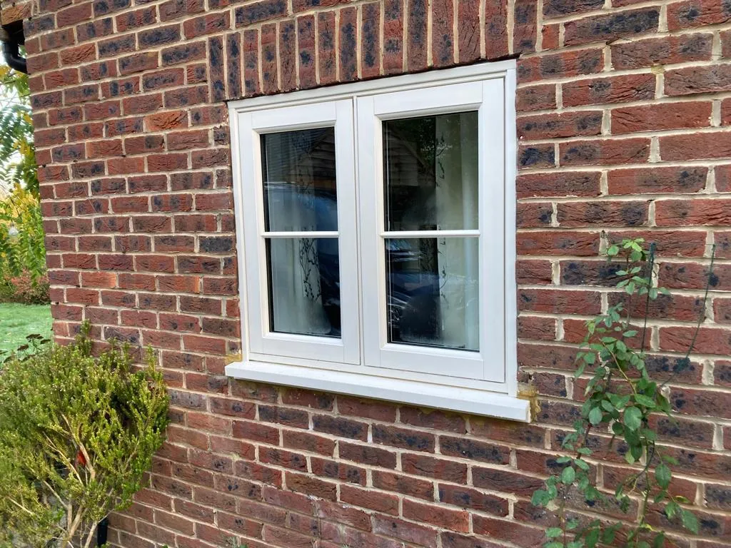 Flush casement windows with Georgian bars set into a brick elevation