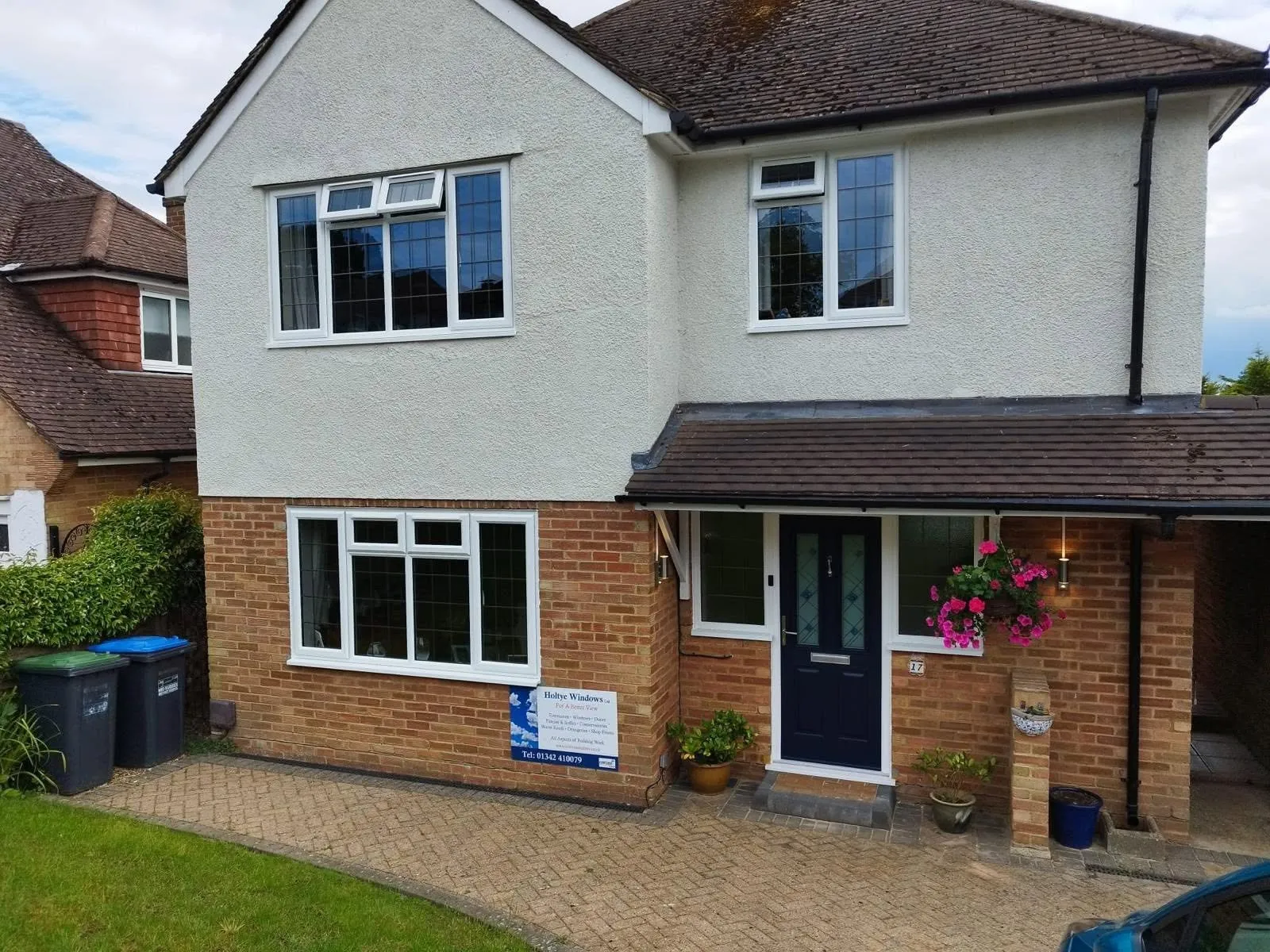 Detached home with a block paved driveway and entrance